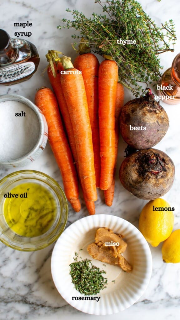 All the ingredients to make roasted beets and carrots including beets and more. 