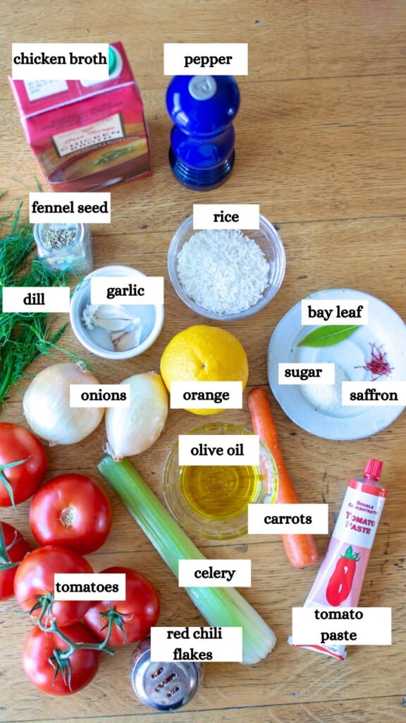 All the ingredients to make tomato rice soup with dill including tomatoes, pepper, dill, rice, bay leaf, chicken broth, and more. 