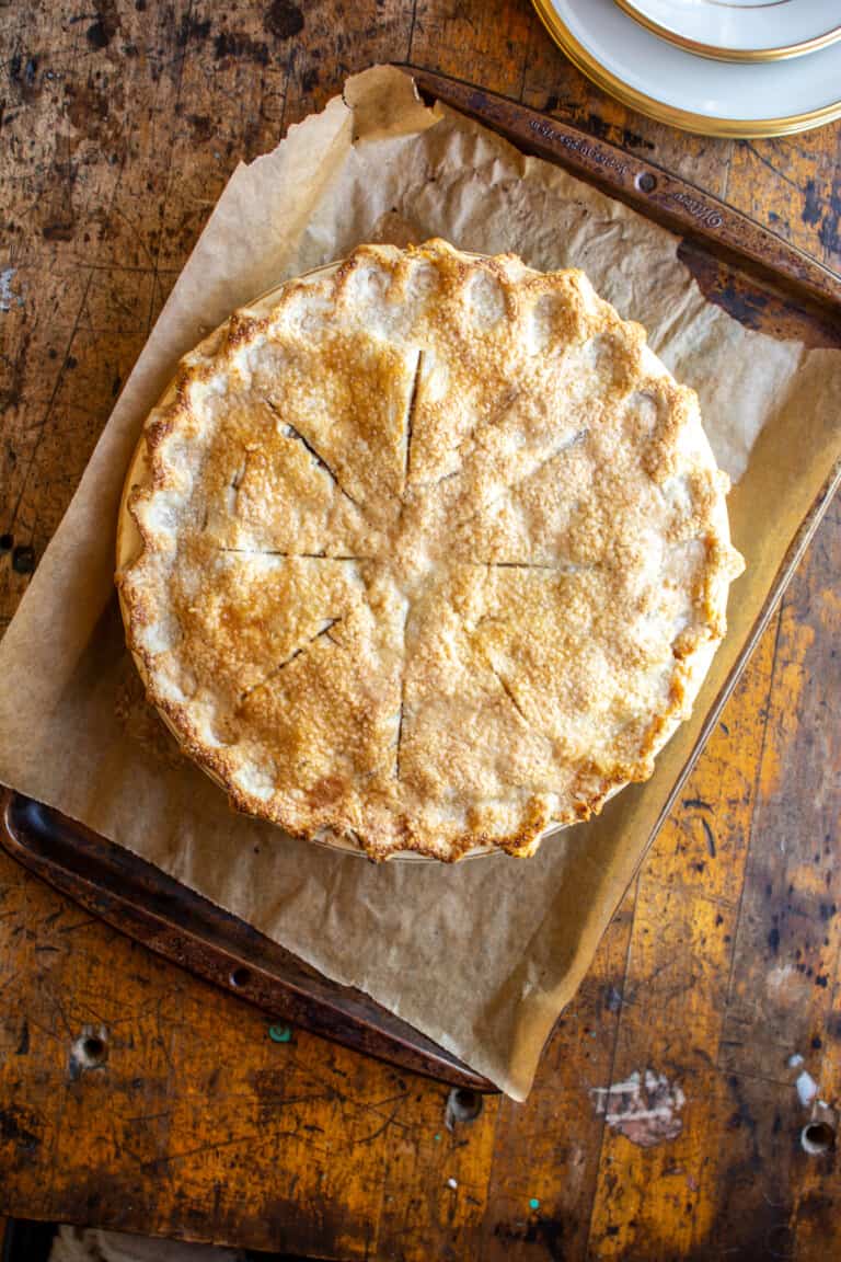 An apple pie on a baking tray
