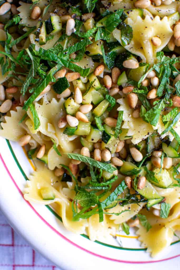 Zucchini pasta with pine nuts and thinly sliced mint. 