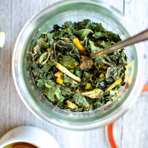 Fig leaf tea in a jar on a gray counter.