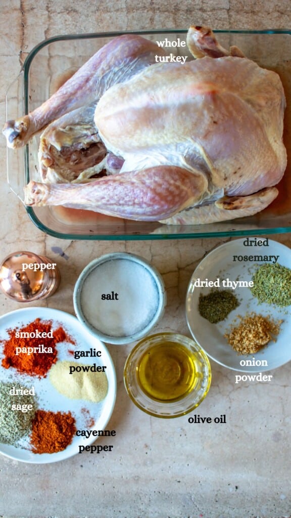 All the ingredients to make Neelys thanksgiving turkey recipe including a turkey and several spices. 