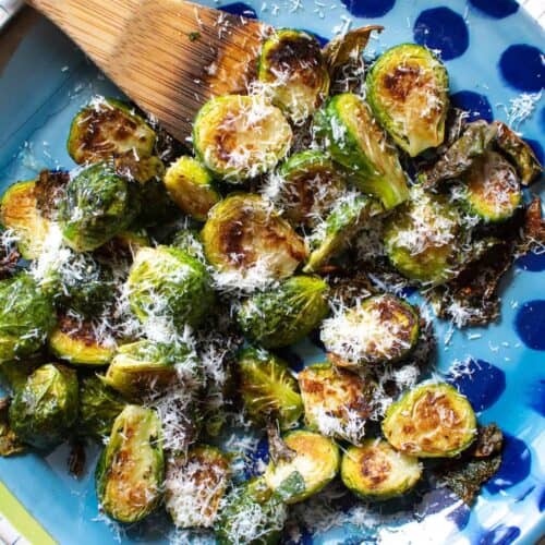 A blue plate of Brussels sprouts