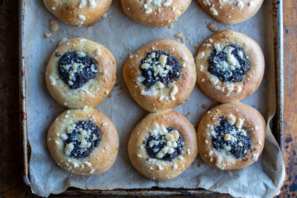 poppy seed kolaches on a baking sheet 