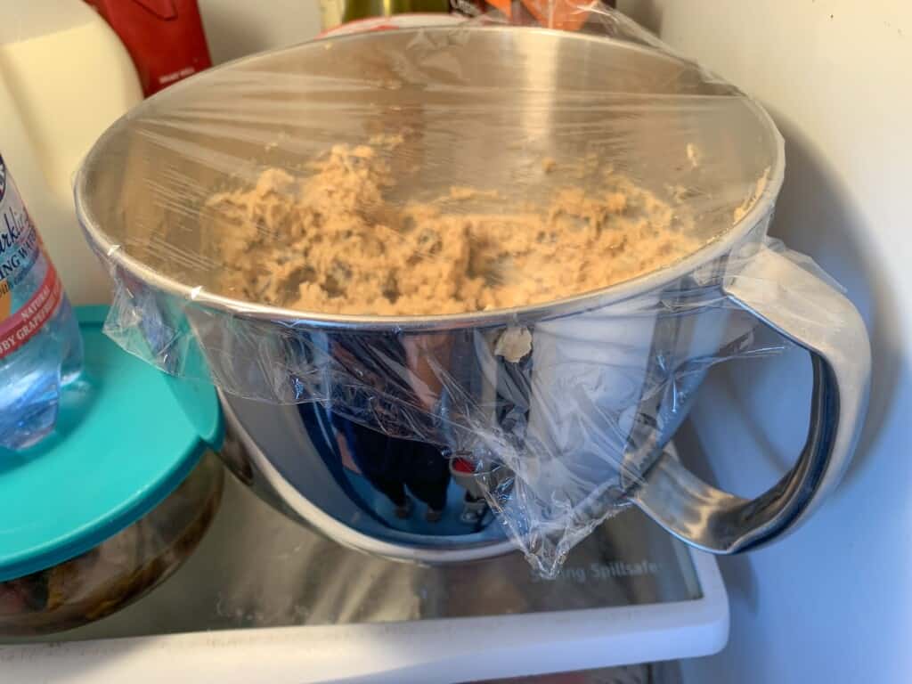 Cookie dough in a mixing bowl in the refrigerator