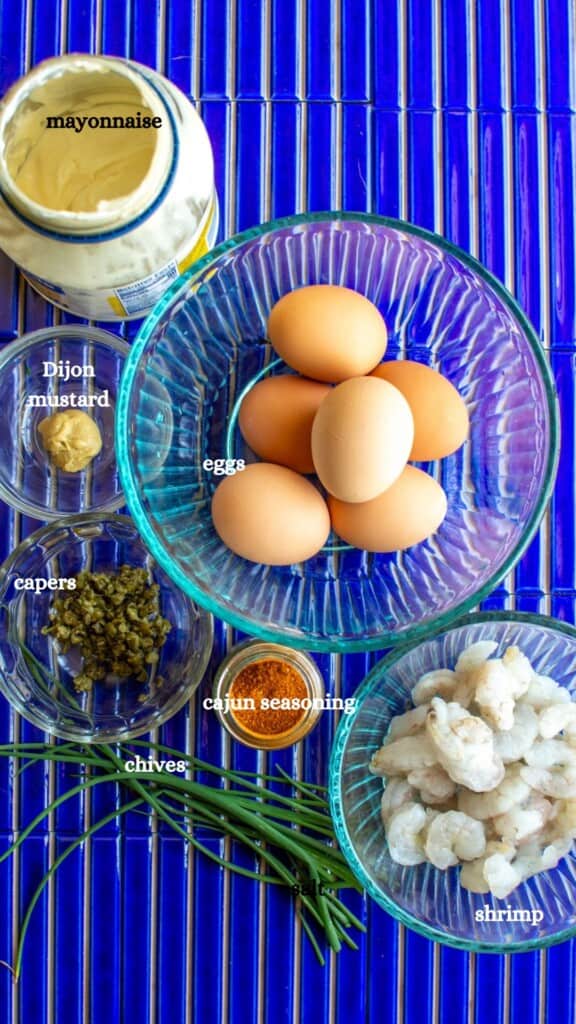 All the ingredients to make cajun deviled eggs including eggs, shrimp, and more. 