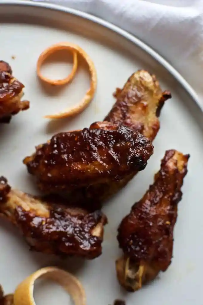 several chicken wings on a plate