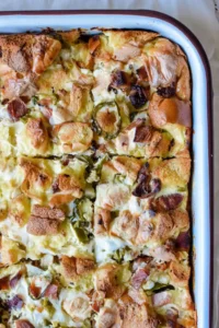 A baking dish filled with with bread and egg casserole.