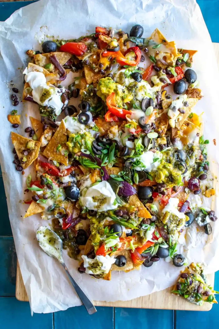 A big pan of nachos topped with guacamole