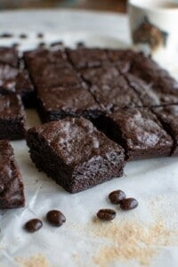 An espresso brownie on a piece of parchment paper