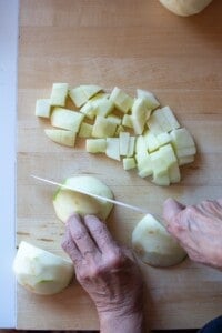 A person chopping apples