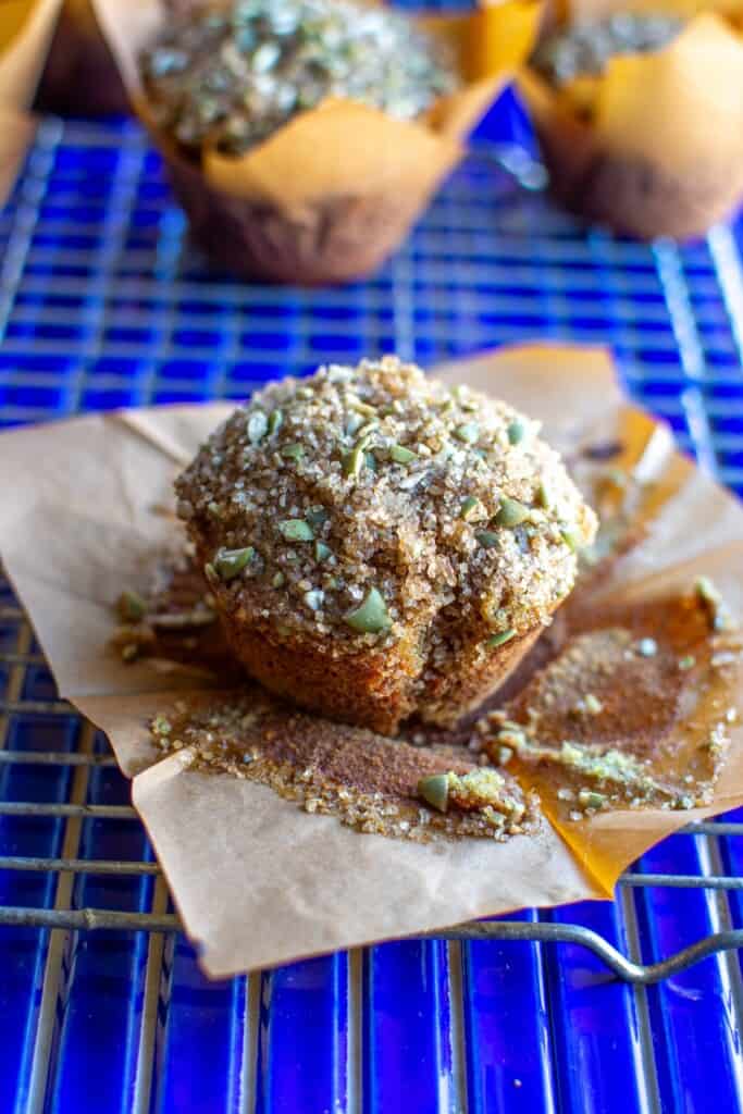 A muffin on a parchment paper wrapper