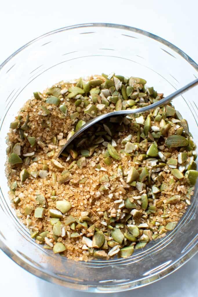 The topping mixture in a glass bowl with a spoon