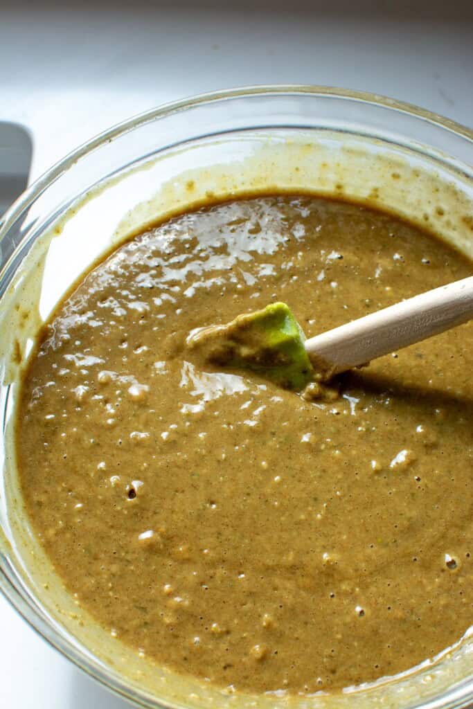 The pumpkin seed muffin batter in a glass bowl