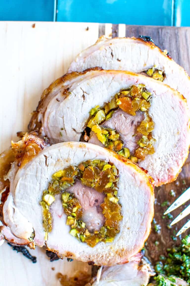 pistachio apricot pork loin slices on a plate