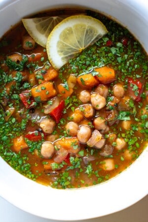 A bowl of Moroccan chickpea stew with chopped cilantro on top