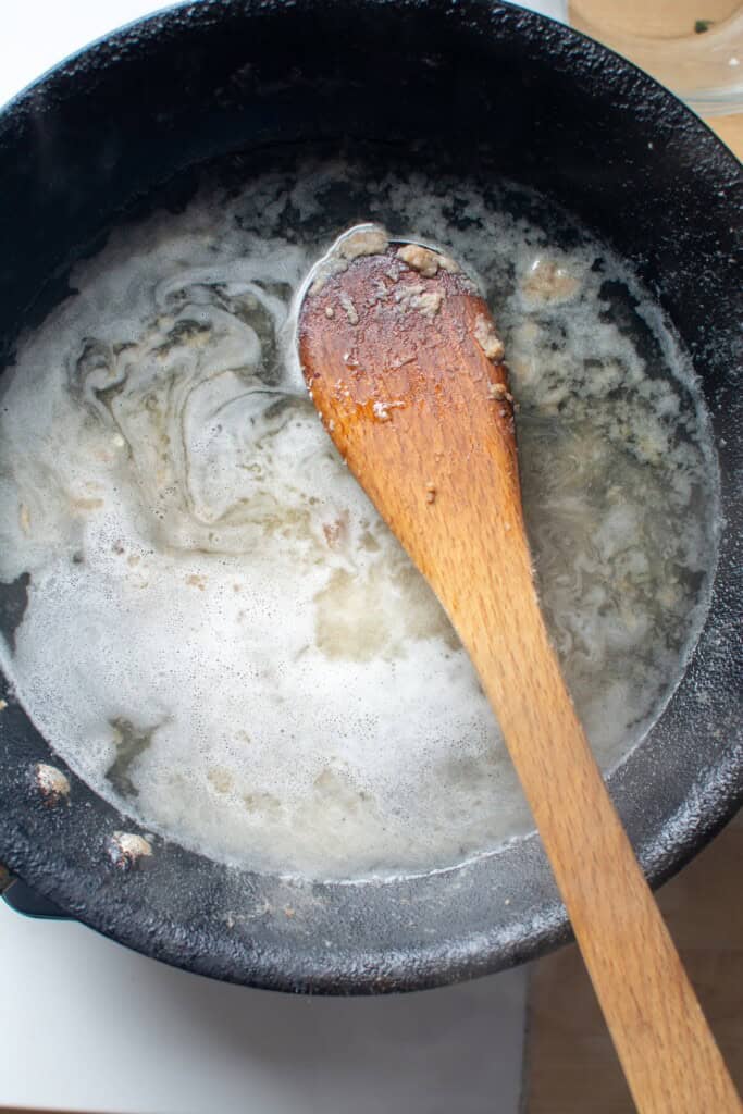 white wine deglazing the pan