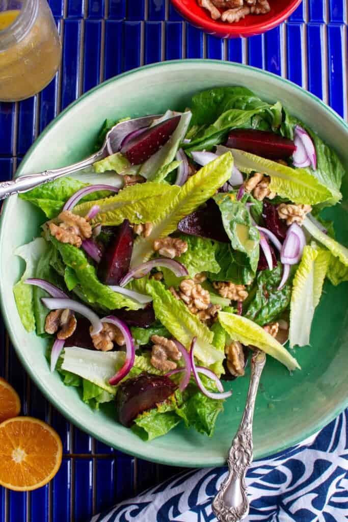 The crunchy romaine salad in a green salad bowl