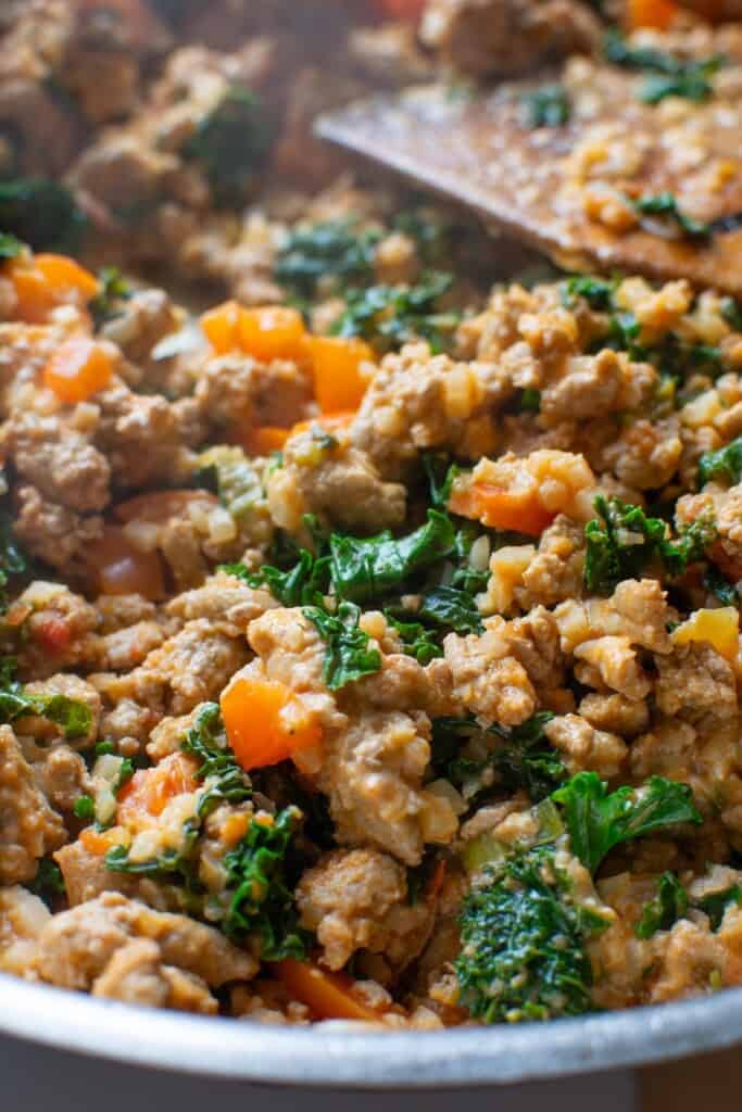 ground turkey being sautéed in a frying pan