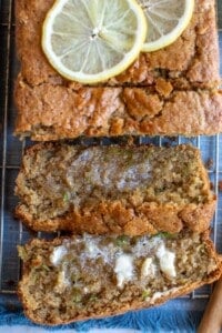 zucchini bread cut into slices with butter