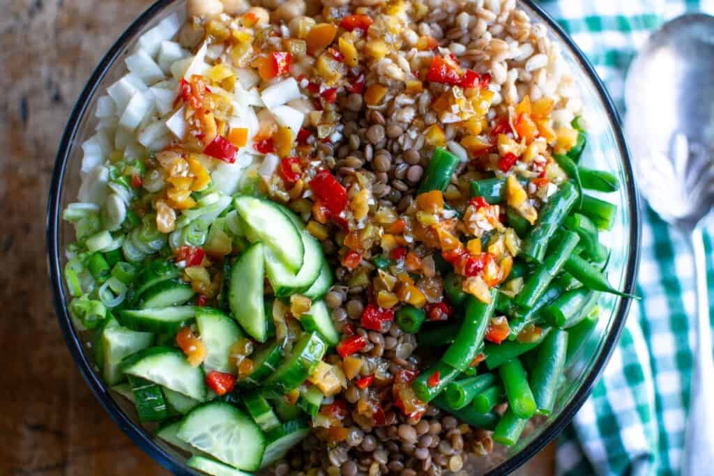 a grain and bean salad topped with cherry pepper dressing