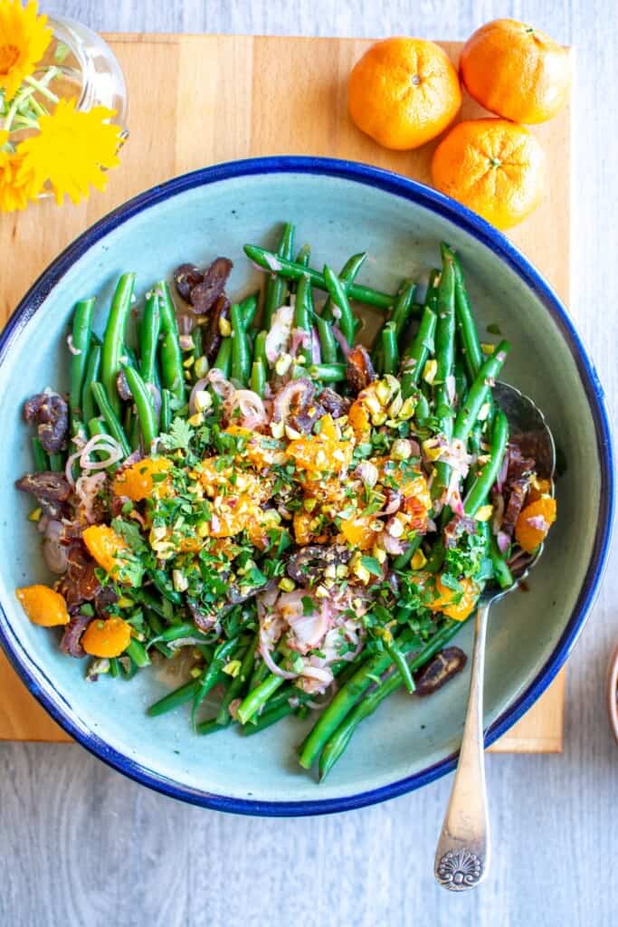 The salad on a platter with a spoon in the dish