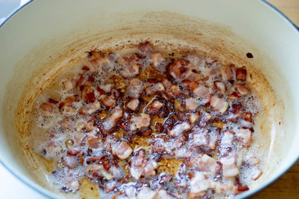 bacon cooking in a Dutch oven