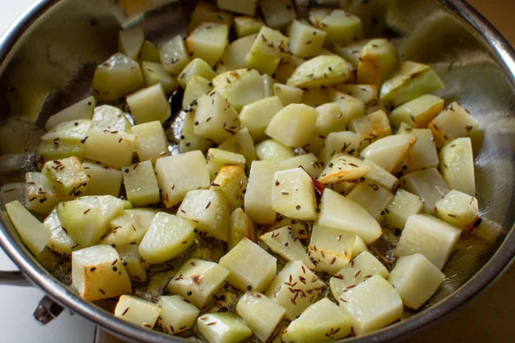 cubed potatoes covered in spices