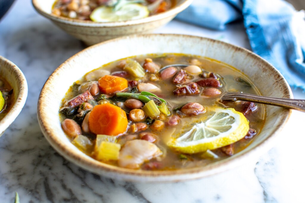 15 bean soup in a bowl with a lemon slice