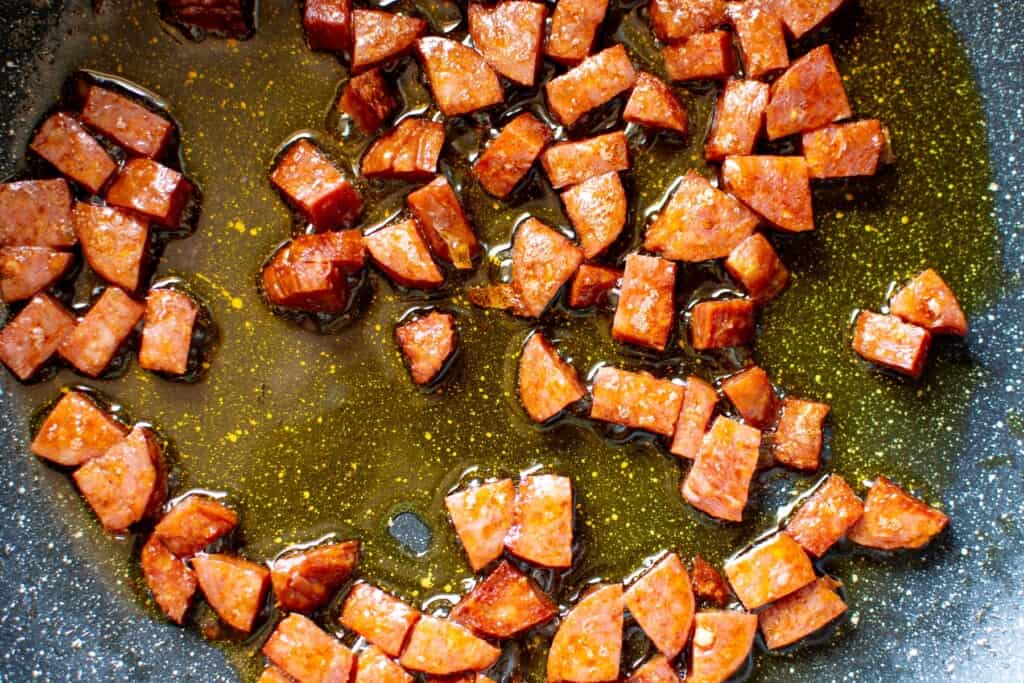 chorizo cooking in olive oil
