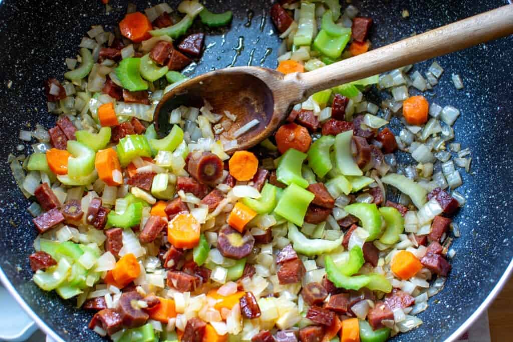 chorizo and vegetables cooking in a pot