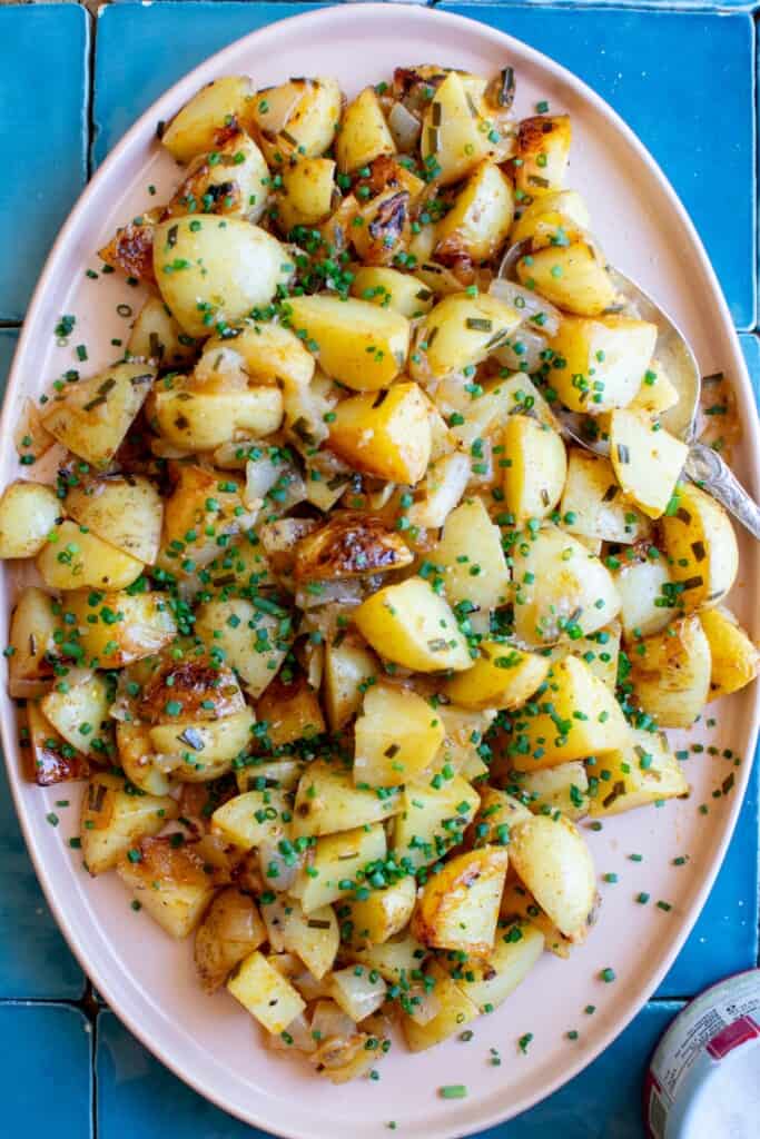 grilled potatoes on a pink platter