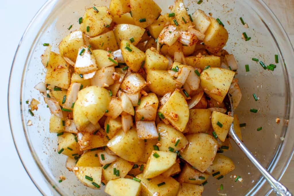 Potatoes cubed in a glass bowl