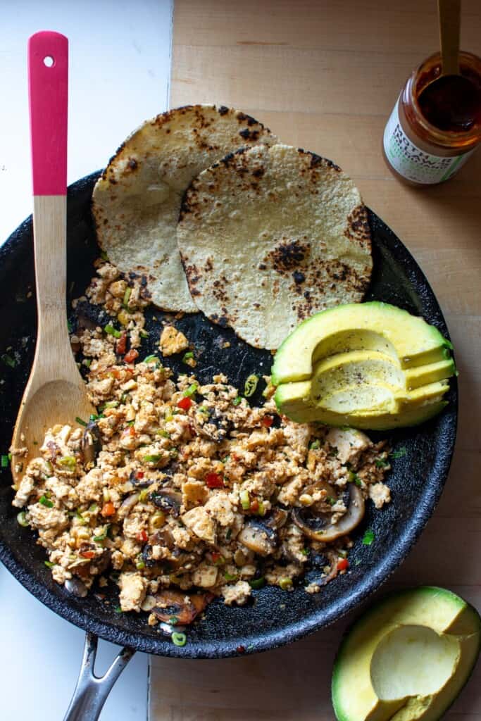 tofu scramble in a black frying pan