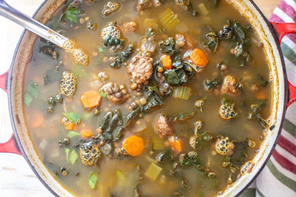 soup finished with a ladle in the pot