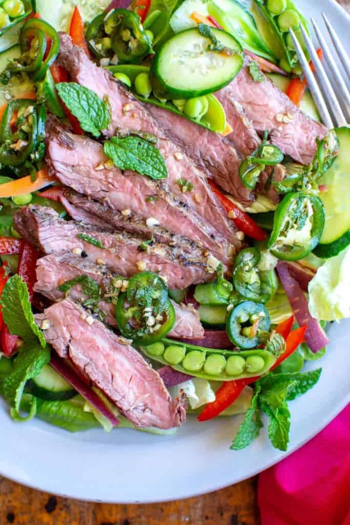 thai steak in a white dish