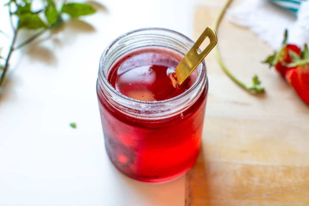 strawberry syrup in a glass jar
