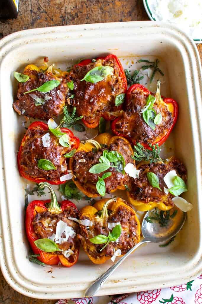 sausage stuffed peppers in a shallow dish