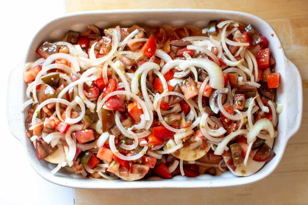 eggplant with onions and tomatoes on top