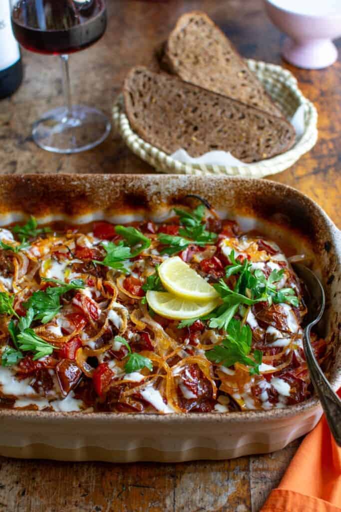Roasted Eggplant with Tomato and Garlic Mayo in a brown dish