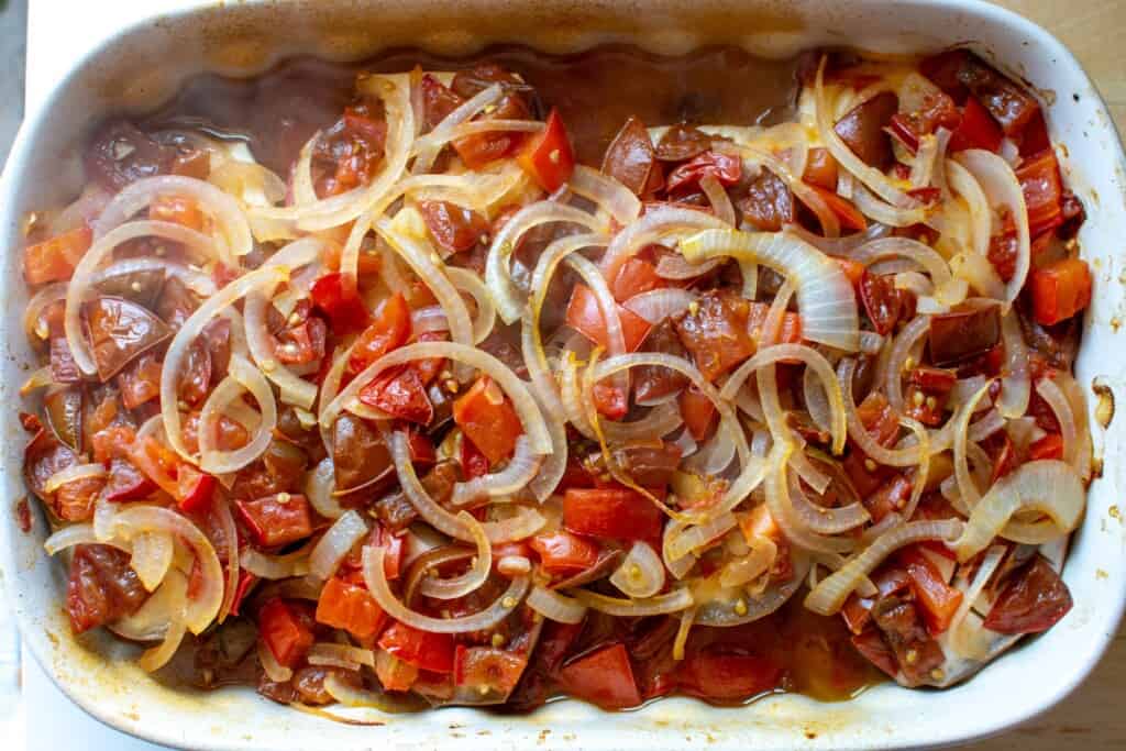 eggplant with roasted tomatoes and onions on top