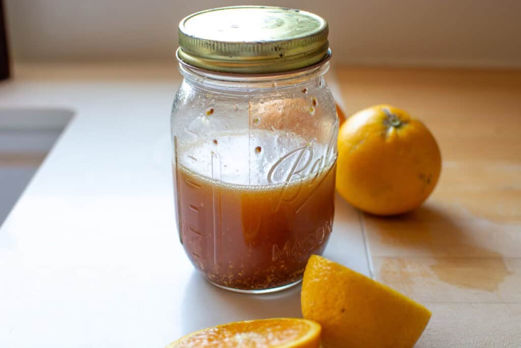 the salad dressing in a small jar