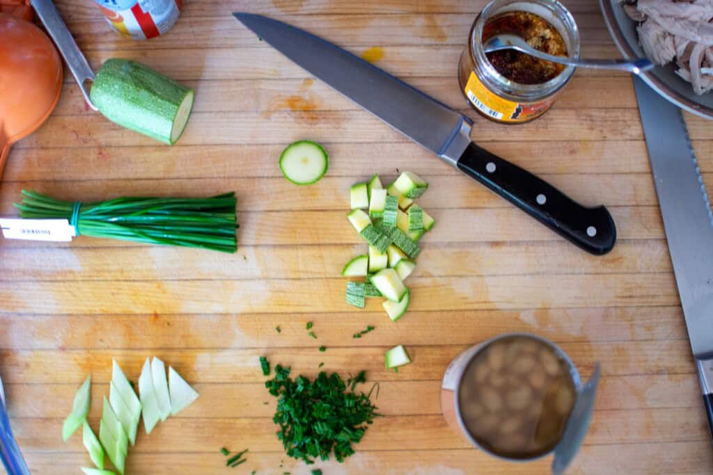 ingredients on a wood cutting board for the salad