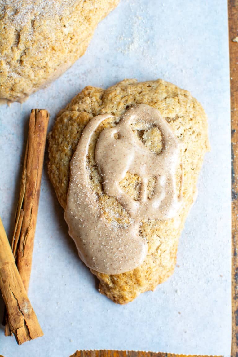 cinnamon scone on a piece of parchment paper.