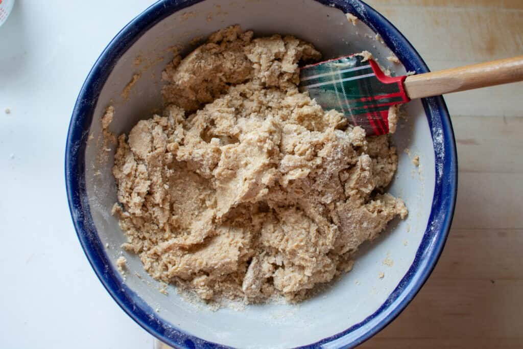 Scone dough in a bowl with a spatula in the bowl