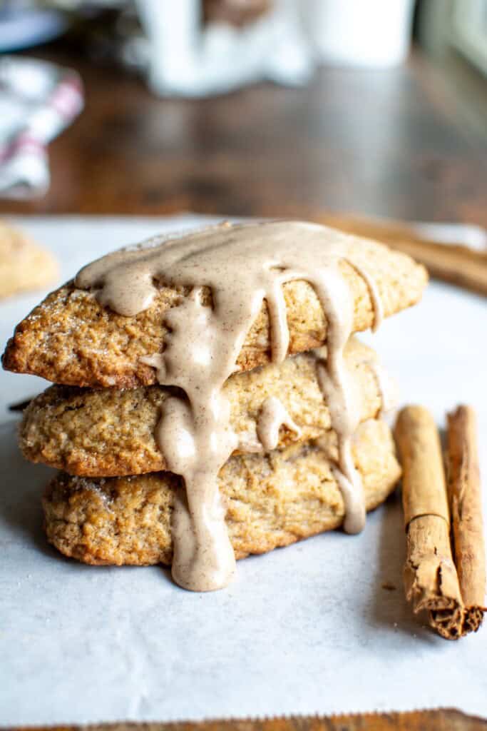 three cinnamon scones stacked on each other