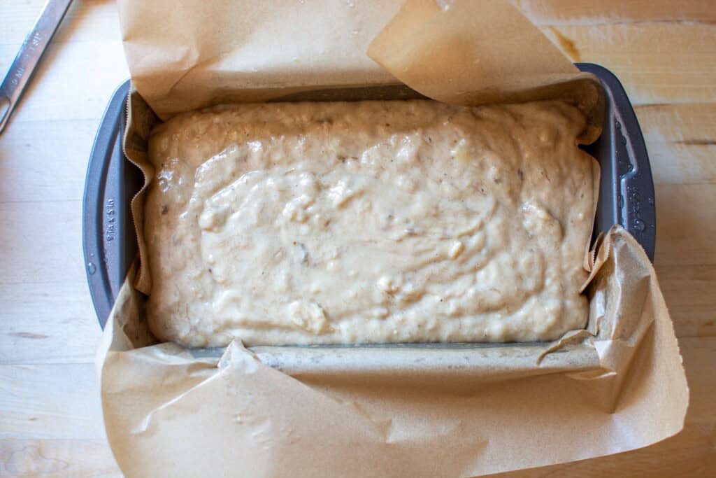 banana bread in a bread pan before going in the oven