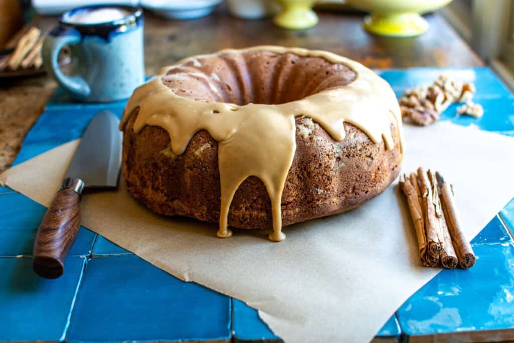 a cinnamon walnut coffee cake on a parchment paper
