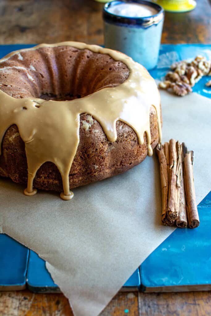 A cinnamon walnut coffee cake on blue tiles