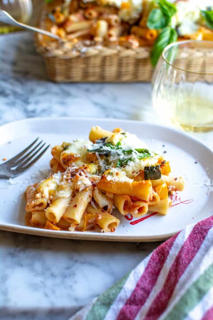 a plate of baked ziti with a fork
